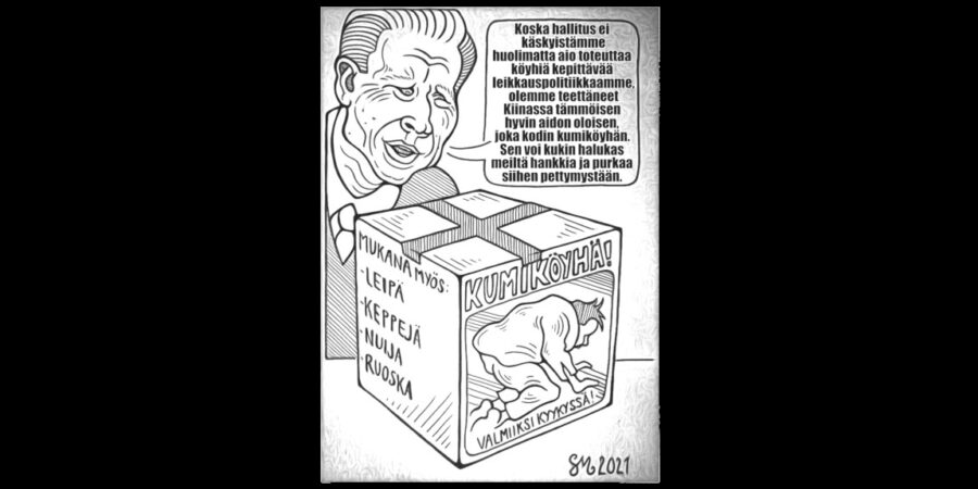 Kuvassa kokoomuslainen esittelee joka kodin kumiköyhää.